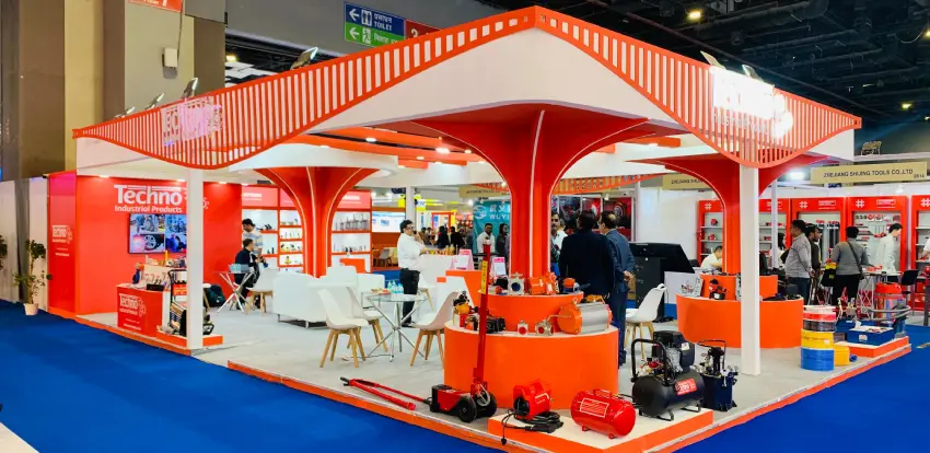 Red and white 84 sqm exhibition stall designed for Techno Industrial Products at TAEE Expo 2026, New Delhi.