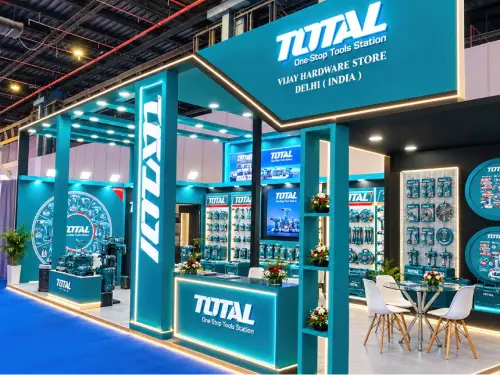 TOTAL One-Stop Tools Station exhibition stall design with teal branding and illuminated structures