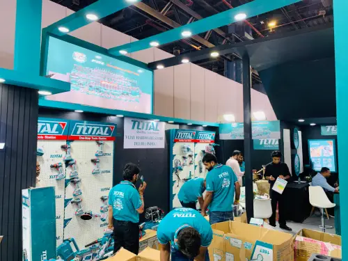 TOTAL tools exhibition stand with product display panels and visitors exploring the showcased tools